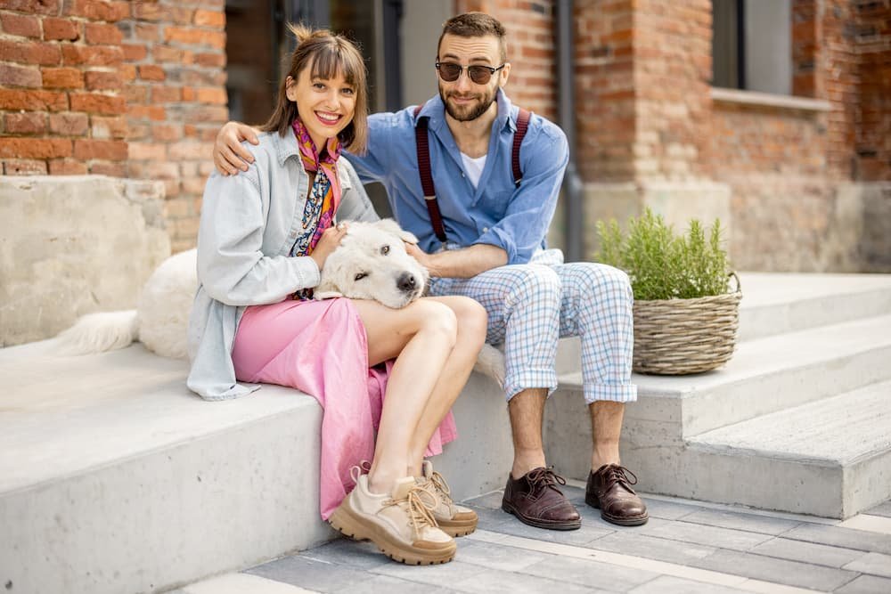 stylish-couple-have-fun-and-sit-with-their-dog-on-2022-06-15-23-37-48-utc.jpg